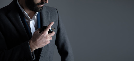 man hand holding perfume bottle