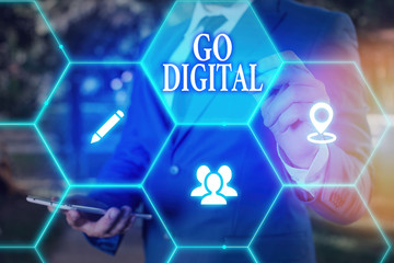 Conceptual hand writing showing Go Digital. Concept meaning Working over the internet Going to...