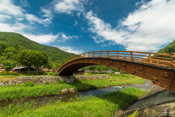 Fototapeta na wymiar Japanese wooden footbridge in Narai historic village in Japan