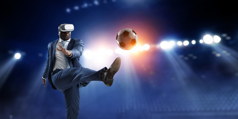 Black businessman on virtual reality football match