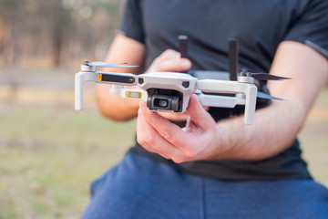 young man controls launches a modern drone
