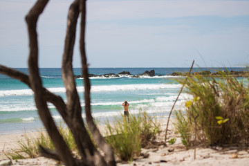 A wandering human on the beach
