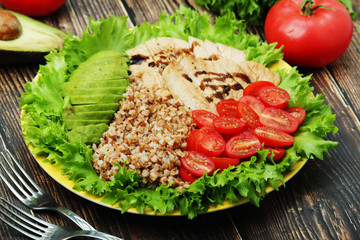 Turkey breast, avocado, salad and buckwheat as healthy lunch	