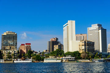 Fototapeta na wymiar Residential and office buildings of the Cairo city. View from Nile river