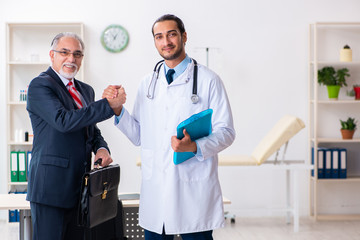 Male doctor and businessman discussing medical project