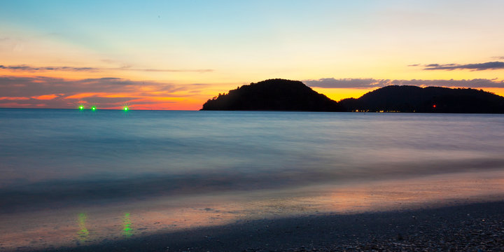 Picturesque sunset on the beach of Langkawi Island, Pantaj Cenang, Malaysia