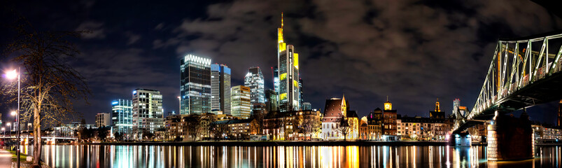 Fototapeta na wymiar Frankfurt, panaorama of the skyscrapers of the city's business center and Eiserner Steg bridge