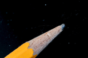 close-up view of a pencil on a black background