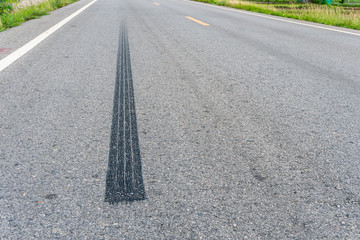 Tire print on asphalt road