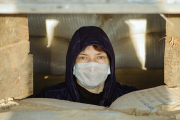 Woman in a disposable medical mask. Covid 19. Pandemic. Ukraine. Europe. Quarantine.