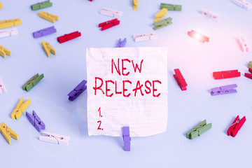 Writing note showing New Release. Business concept for announcing something newsworthy recent...