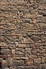 Volterra (SI), Italy - April 25, 2017: A typical tuscany brick wall in Volterra town, Tuscany, Italy