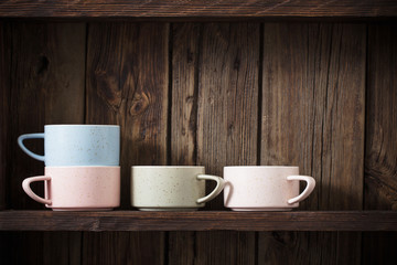  kitchen dishware on old dark wooden background