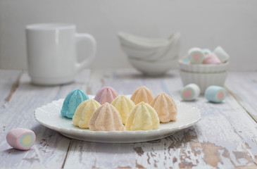Color fruit marshmallows on the old pink table