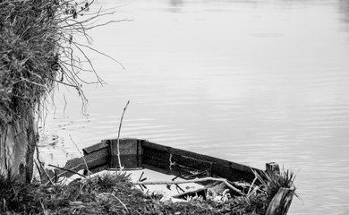 Broken Old Boat Filled with Water in River Texture Background