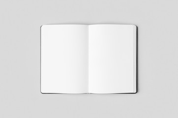 Notebook inside mockup on a grey background.