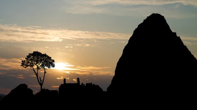 Machu Picchu: Ruins of the Lost Inca City, Time Lapse at Sunrise with Colorful Clouds and beautiful mountains Huayna Picchu, Peru