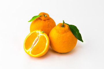 Cross section with fresh orange Hallabong on white background. Fruit seen from above. (Korea, Jeju...