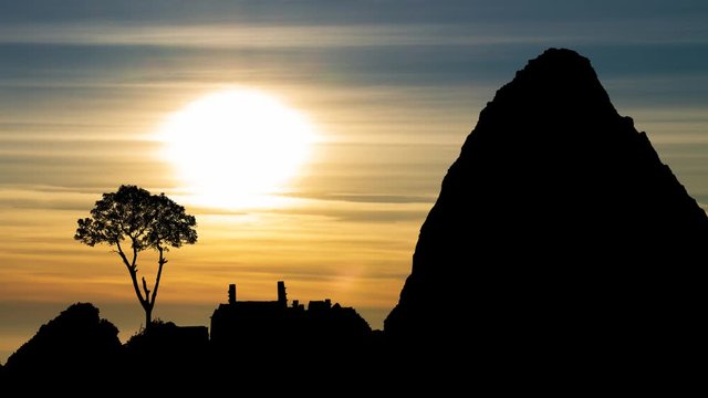 Machu Picchu Ruins and Mountains, Time Lapse at Sunset with Colorful Clouds, Peru