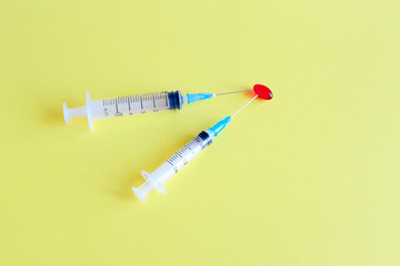 New coronavirus, 2019 nkoV virus concept. A cure for viral infection and a syringe with a vaccine....