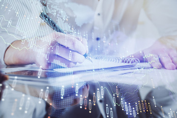 Multi exposure of man planing investment with stock market forex chart.