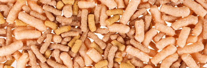 Fish food in sticks for aquarium and pond fish. Fish feed background