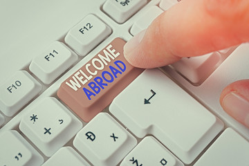 Conceptual hand writing showing Welcome Abroad. Concept meaning something that you say when someone...