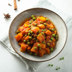 Homemade pumpkin curry with green pea