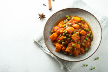 Homemade pumpkin curry with green pea
