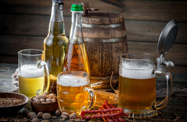 Light beer in a glass, on an old background.