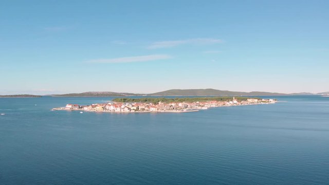 Aerial view of a isolated Krapanj island in the middle of Adriatic sea in Croatia, scenic travel touristic destination for summer holiday