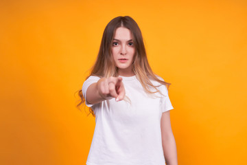 Obraz premium Young calm girl shows straight on you