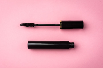 Mascara on pink background. Basic products for eyelashes makeup. - obrazy, fototapety, plakaty