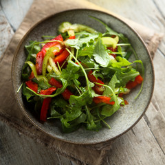 Healthy arugula salad with vegetables