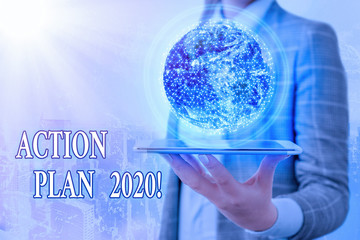 Conceptual hand writing showing Action Plan 2020. Concept meaning proposed strategy or course of...