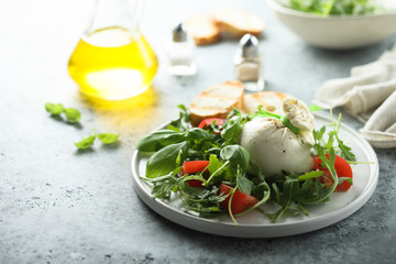 Homemade burrata cheese salad with tomatoes
