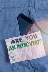 Writing note showing Are You An Introvertquestion. Business concept for demonstrating who tends to...