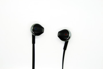 black wired headphones on white background