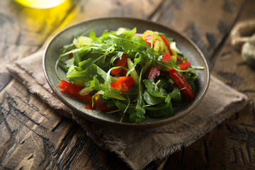 Healthy arugula salad with vegetables