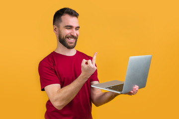 Young bearded man betting online at bookmaker's website