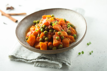 Homemade pumpkin curry with green pea