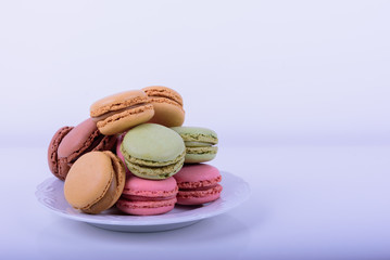Colorful macaroons cake, sweet macaroon on white table background, food background