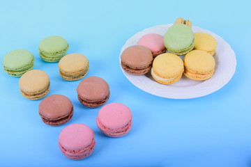 Colorful macaroons cake, sweet macaroon on blue background, food background