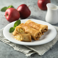 Crepes filled with apple and cinnamon