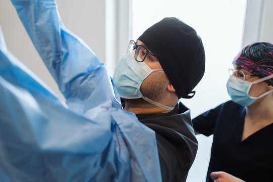 Doctor prepering for surgery in clinic.