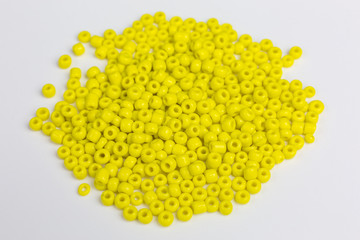 heap with tiny yellow glass beads for embroidery