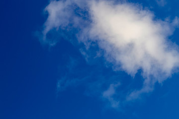 Fototapeta na wymiar Bright white clouds on blue sky. Beautiful background.