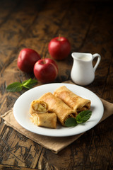 Crepes filled with apple and cinnamon