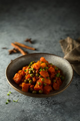 Homemade pumpkin curry with green pea
