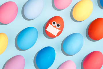 Painted eggs on pastel background. Stay at home concept.